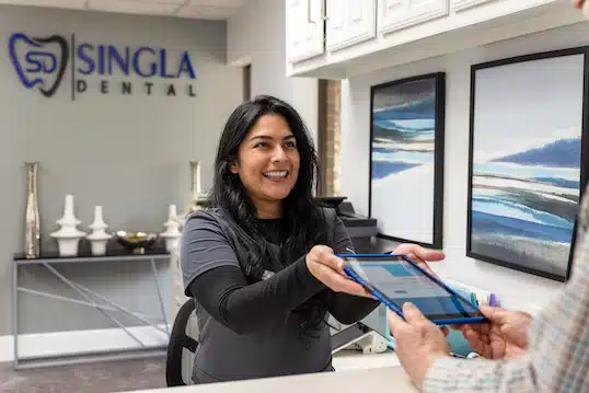 Checking in patient at Singla Dental in Duncanville,TX